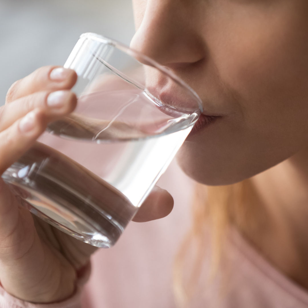 woman drinking water optimum
